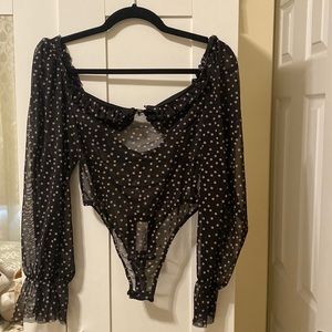 Brand new pretty little things see through body suit size 6 for upto size 8.